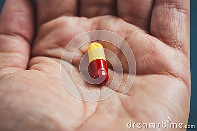 close-up view of a hand a pill Stock Photo