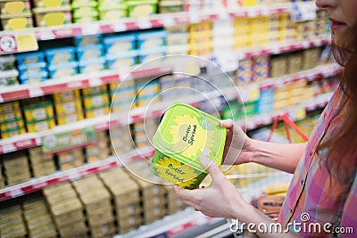 Close up view of hands holding butter Stock Photo