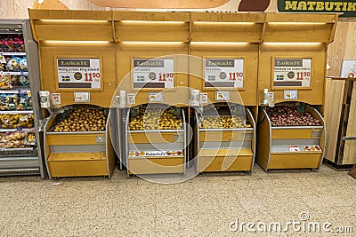 Close up view of interior view of famous ICA supermarket. Stands of different potato sorts. Editorial Stock Photo