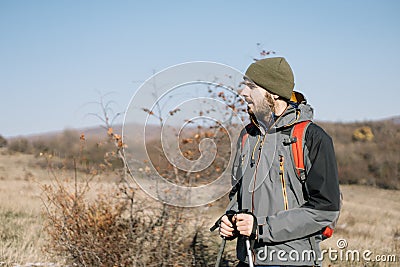 Close-up view of male tourist standing on field Stock Photo