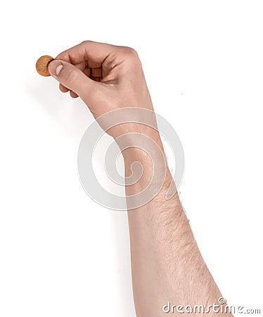 Close up view of man's hand holding coin Stock Photo