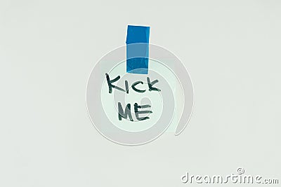 close up view of note with kick me lettering and sticky tape Stock Photo