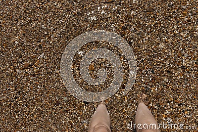 A close up view of a pair of feet buried i Stock Photo