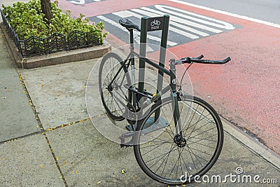 Close-up view of parked bicycle in parking lot on New York street in Manhattan. New York. USA. . Editorial Stock Photo