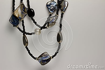 Close up view of a pretty multi-strand black beaded costume jewelry necklace on a white background Stock Photo