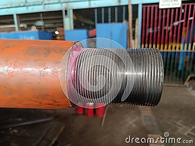 Close-up view of a propeller shaft tip with detailed threads undergoing non-destructive testing for cracks Stock Photo