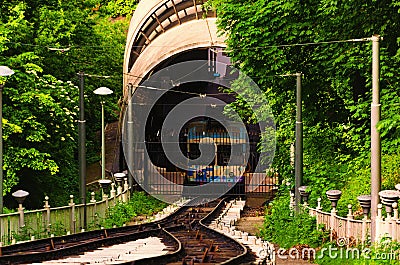 Close-up view of rails path funicular, vertical path, sleepers, cable for the funicular. Closed the lower station with carriage Stock Photo