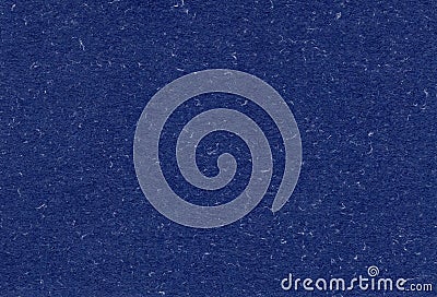 Close up view of recycled dark blue paper background with inclusions of natural fiber particles. Stock Photo