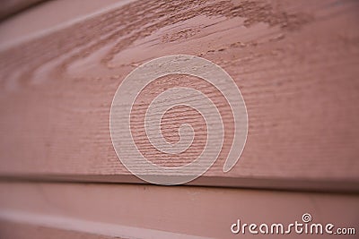 Close up view of a red grainy wood house plank Stock Photo