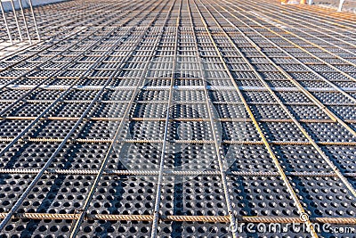 Close up view of reinforcement of concrete. Geometric alignment of Rebars on construction site. Reinforcements steel Stock Photo