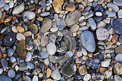 A close up view of smooth polished multicolored stones washed a Stock Photo