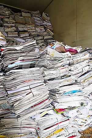 Close up view of stacks of paper and magazines and newspapers ready to be recycled Editorial Stock Photo