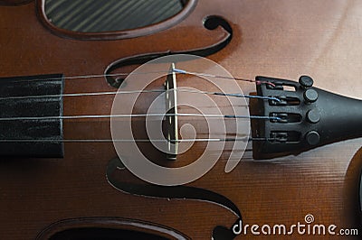 Violin lying on wooden background Stock Photo