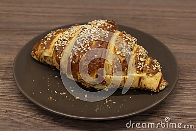 Croissant sprinkled with sesame Stock Photo