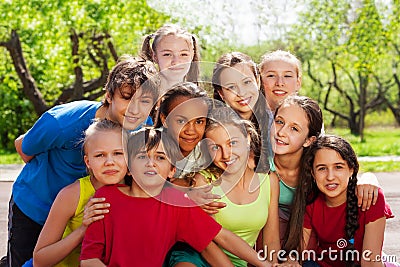 Close-up view of teenagers sitting and hugging Stock Photo