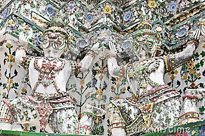 Close-Up View of Thai Demon Sculptures at Wat Arun Ratchawararam Editorial Stock Photo