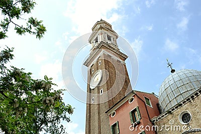 Church of the Holy Apostles of Christ in Gothic-Renaissance style in Venice in spring flowering time. Stock Photo