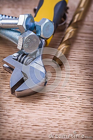 Close up view on tools screws bolt wrench drill On Stock Photo