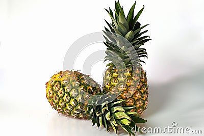 Close up view of two colorful pineapples isolated. Food concept. Healthy eating concept. Stock Photo