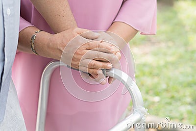 close-up view two seniors holding hands together. Stock Photo