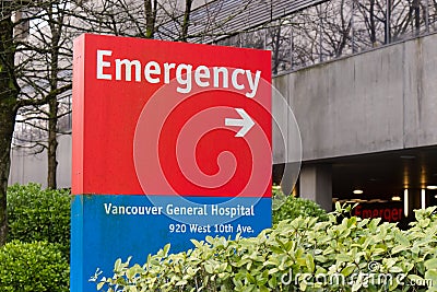 Close up view of Vancouver General Hospital emergency sign in red with directional arrow Editorial Stock Photo