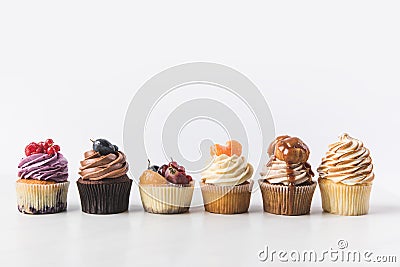 Close up view of various sweet cupcakes on cake stand Stock Photo