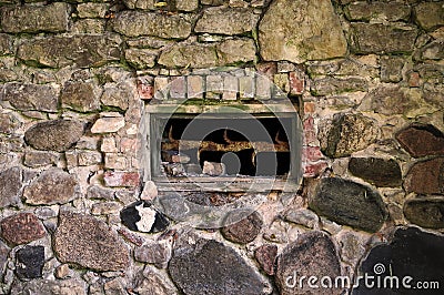 Close up view of a very old brick and stone wall with a window Stock Photo