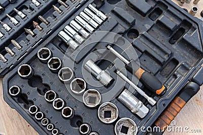 Close-up view of a well-organized toolbox containing various sizes of sockets, socket wrenches, and other related tools. The tools Stock Photo