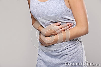 Close up view of woman suffering from abdominal pain Stock Photo