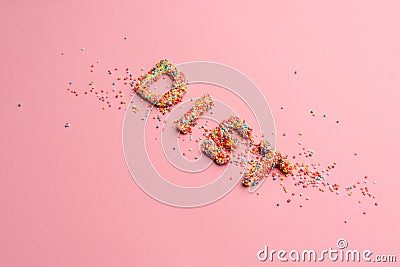 Close-up view of word diet made from sweets isolated on pink Stock Photo