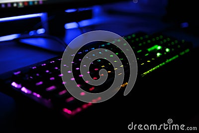 Close up view of workplace with led rainbow backlight gaming key Stock Photo