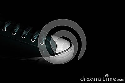 Close-up of vintage sneaker shoe of tidewater green of color, 2021 trend. Isolated on black background with copy space. Stock Photo