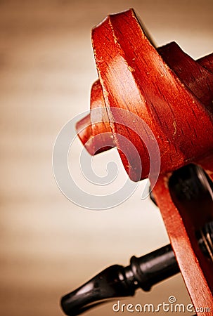 Close Up of Violin Scroll in front of Sheet Music Stock Photo