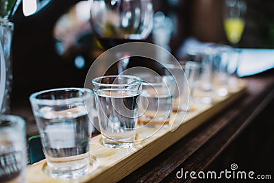 Close up on Vodka shots and other alcohols in a row Stock Photo