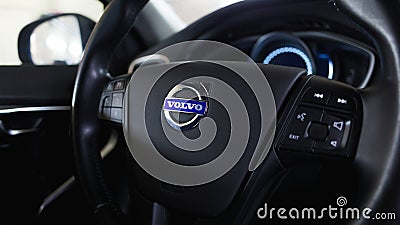 Close up Volvo logo on the steering wheel. Volvo V40 dashboard interior. Editorial Stock Photo