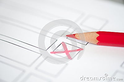 Close up voting bulletin with red pencil. Concept of election. Stock Photo