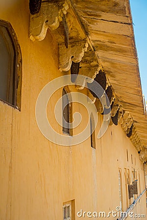 Close up of a wasp nest hanging from the ceiling of a building at outdoors, in Amber Fort near Jaipur, Rajasthan, India Stock Photo
