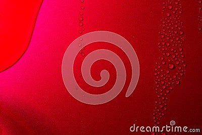 Close up of water drops on dark red tone background. Abstract red wet texture with bubbles on plastic PVC surface or grunge. Stock Photo