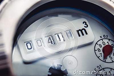 Close up of water meter with rotating digit Stock Photo