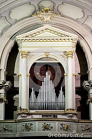 Close up of a well decorated and luxurious pipe organ in a church Stock Photo
