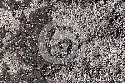 Close-up of wet destructed asphalt road pavement Stock Photo
