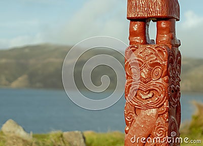 Close up of whakairo pouwhenua with background Stock Photo