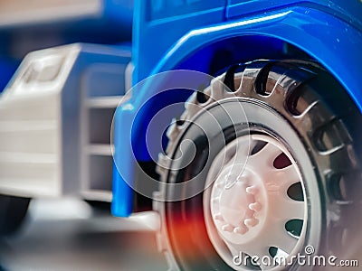 Close-up of a wheel from a blue children`s toy car. Closeup of children`s toys and goods Stock Photo