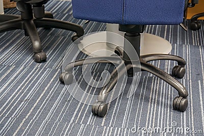 Close up wheel of office chairs on the floor Stock Photo