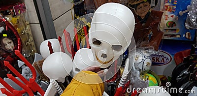 Close up of white bold scull head in female hand exposed for sale in a shop before jewish pur Editorial Stock Photo