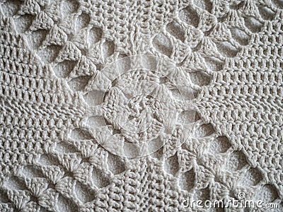 Close up of white crocheted fabric pattern in a cross Stock Photo