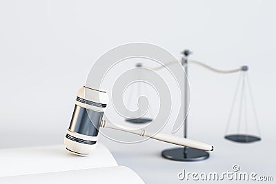 Close up of white gavel, scales and book/journal on light backdrop. Lawyer, justice and punishment concept. Stock Photo