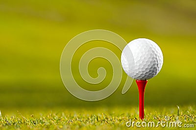 Golf ball on tee Stock Photo