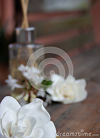 Close-up of white jazmin flowers on a rustic table. Aromatherapy set Stock Photo