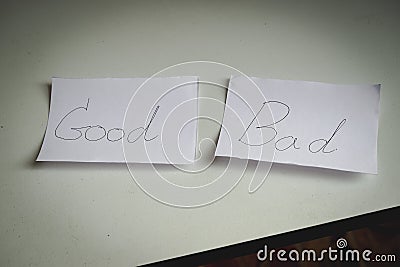 Close up of white papers with words Good versus Bad choices that place on table Stock Photo